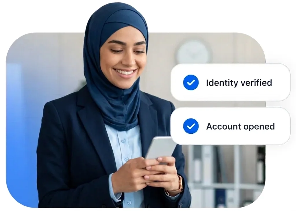 Customer on smartphone in a professional office with identity verified and account opened confirmation — remote banking onboarding