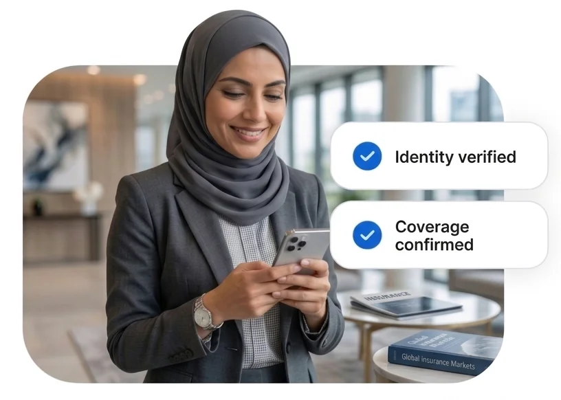 Insurance professional on smartphone with identity verified and coverage confirmed — policyholder onboarding
